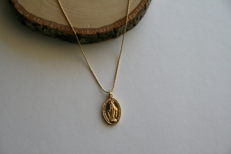 Gold Miraculous medal on delicate ball chain